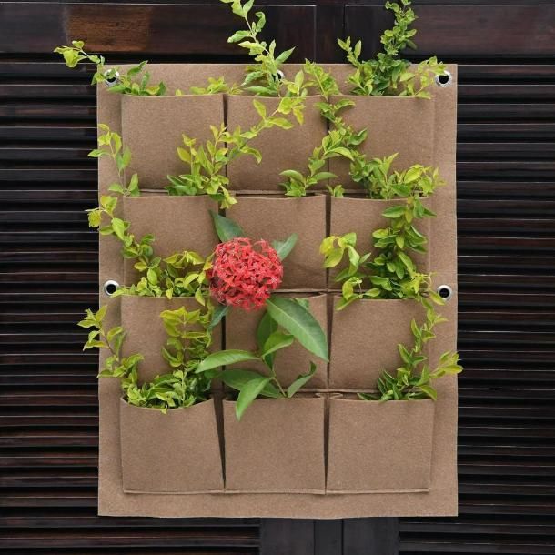 Vertical balcony garden planter with multiple pockets for growing herbs and small plants